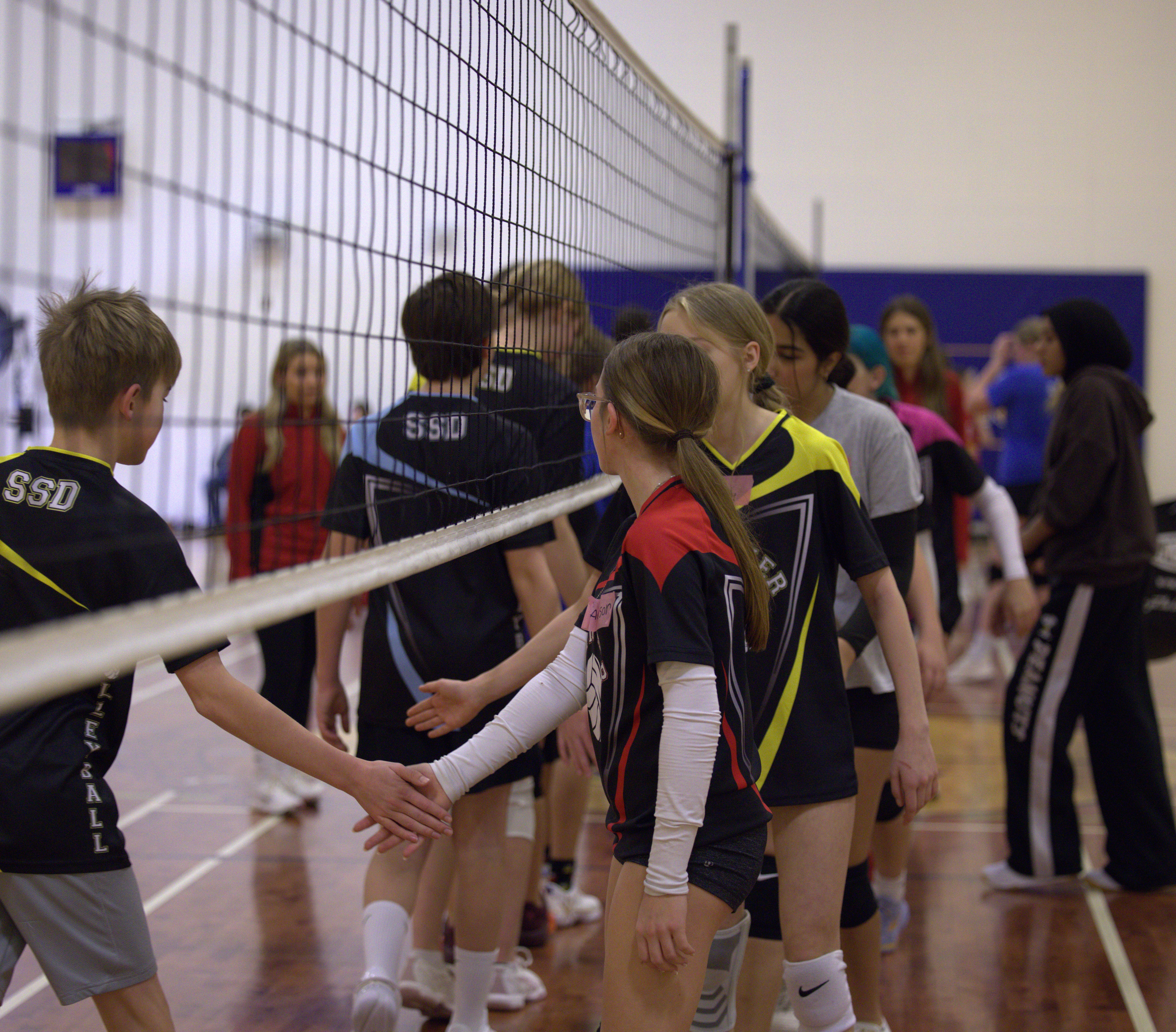 Stryker Volleyball athlete executing a play on court